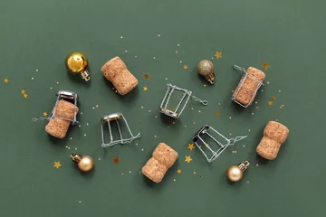 Fotobehang Champagne corks with Christmas decor on green background © Pixel-Shot