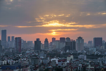 Fototapeta premium Hanoi cityscape at sunset with arising high buildings in Dong Da district