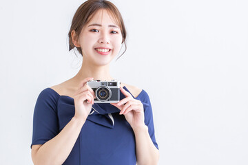 笑顔でカメラを持つ女性　camera　picture