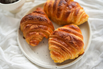 Breakfast hot coffee and croissants
