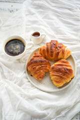Breakfast hot coffee and croissants