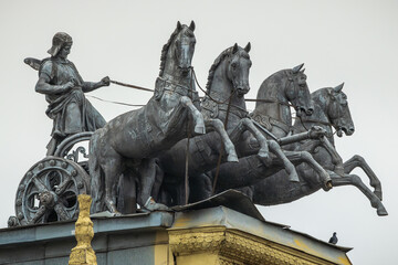 Statue of a chariot and charioteer on the roof of the Moscow hippodrome, Russia