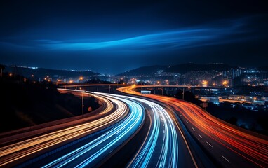 Fototapeta na wymiar Highway in the mountains at night with motion blur and blue sky