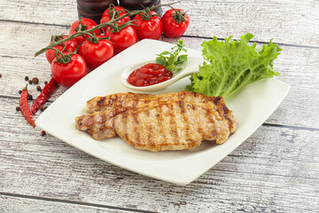 Grilled pork steak with ketchup