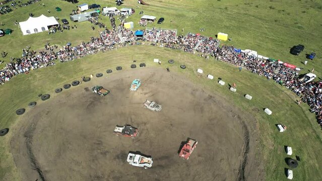 Drone angle of cars crashing into each other at Demolition Derby