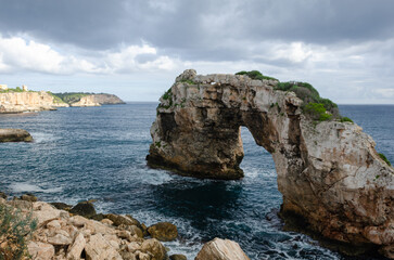 Obraz premium Beautiful sights in Mallorca Spain of the rugged coast, Mediterranean sea and charming architecture