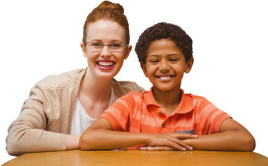 Digital png photo of diverse female teacher with schoolboy at desk on transparent background