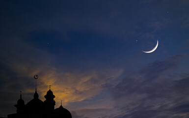 Night sky with crescent moon and stars of Ramadan sky.  Mosque dome, Islamic landmark.mosque dome...
