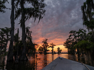 Dramatic Sunset at a Louisiana Bayou Swamp with a Boat Hull in the Foreground
