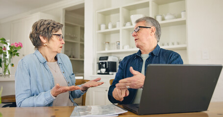 Laptop, budget and stress with a senior couple in their home together, talking about accounting or finance. Tax, debt or financial crisis with an elderly man and woman in disagreement about money - obrazy, fototapety, plakaty