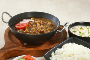 Chole Chawal or Chole Masala Rice with Boondi Raita, Indian dish