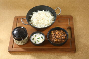 Chole Chawal or Chole Masala Rice With Raita, Indian dish