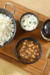 Chole Chawal or Chole Masala Rice With Raita, Indian dish