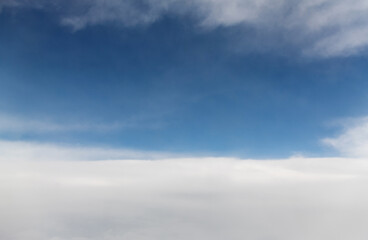 Looking at the clouds and sky on the plane