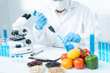 Scientist check chemical food residues in laboratory. Control experts inspect the concentration of...