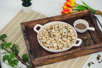 Rice dumplings - Famous sourashtra snack recipe with pepper, jeera and curry leaves. Localled called neer Kozhukattai. Also called Thanni Kozhukattai. Health snack for all age group.