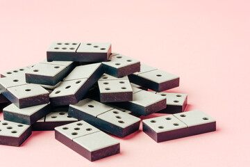 Domino tiles on pink background studio shot