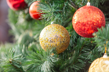 Toys on an artificial New Year tree