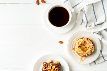 Almond tart and brownie on white background
