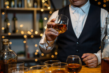 Barman pouring whiskey whiskey glass..