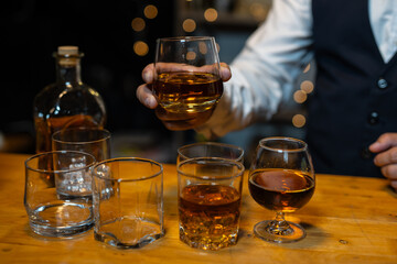 Businessman wearing a suit whiskey glass of liquor.