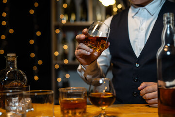 Barman pouring whiskey whiskey glass..