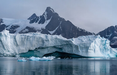 Antarctic landscape with icebergs, mountains and ocean in Antarctica