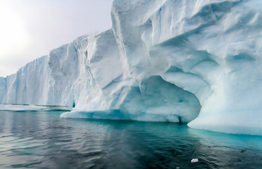 Antarctic landscape with icebergs and ice floes in the ocean