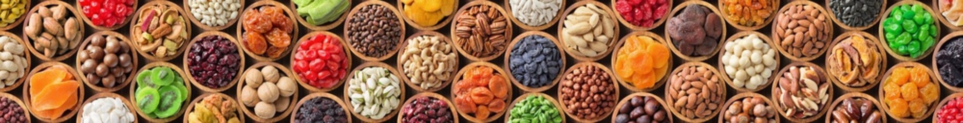 assorted nuts and dried fruit. long panoramic food background. - Powered by Adobe