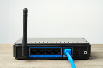 Modern router with cables plugged in close up