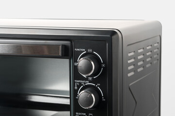 Fototapeta premium Close up of black mini electric oven home appliance