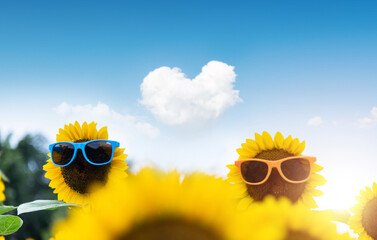 Sunflower wearing sunglass under blue sky - Powered by Adobe