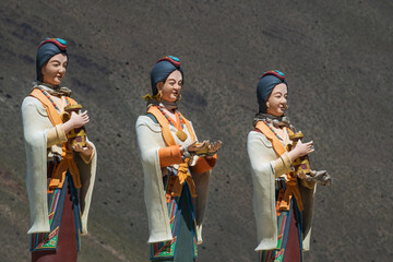 	 Welcoming statues on Muktinath road, Statue of Three Nepali women, Annapurna Mountains, Nepal	