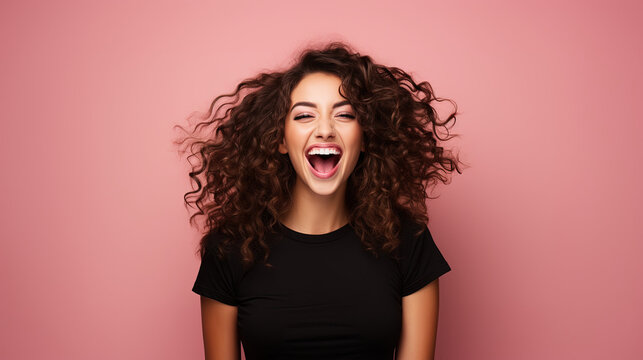 Happy wonderful young woman with long curly hair excited isolated on pink background