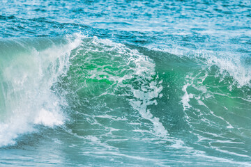 Wave splashing close-up. Crystal clear sea water, in the ocean in San Francisco Bay, blue water, pastel colors.