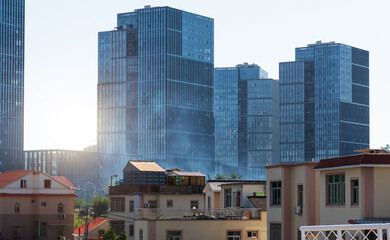 Modern office buildings and old houses in the city