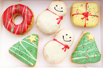 Paper Box Filled with Delectable Assorted Christmas Decorated Doughnuts