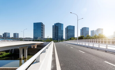 Asphalt road bridge near office buildings