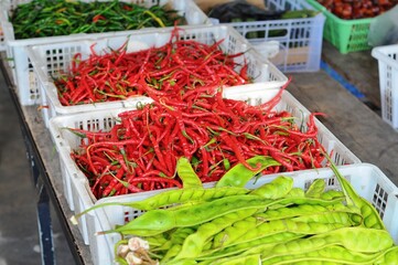 red chilies, green chilies and petai in minimarkets
