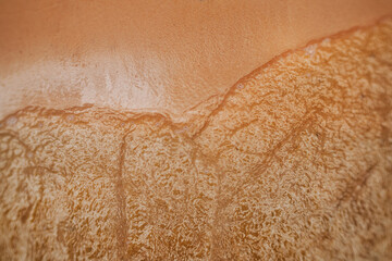 Water washing up on shore from above