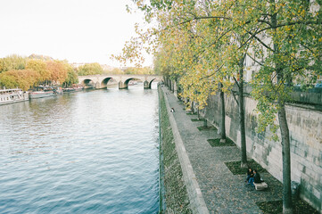 Fototapeta na wymiar The river Seine with fall colored trees in Paris france