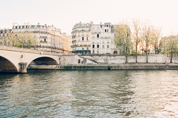 Fototapeta premium dreamy view of Paris lit up with golden light along the seine