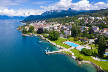Aerial view of Evian (Evian-Les-Bains) city in Haute-Savoie in France - 679529846