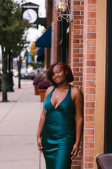 Female ethnic model with red hair smile and pose with downtown