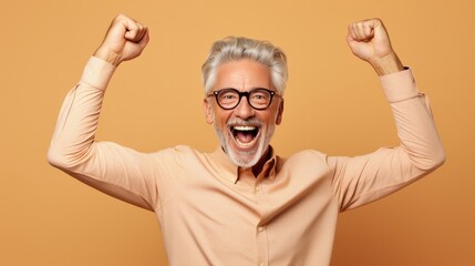 Fototapeta premium hooray elder grey hairdo man indicate empty space wear spectacles shirt isolated on beige color background, joyful, cheerful, adult, achievement, retirement, happy