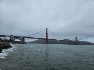 View of Golden gate bridge in San Francisco California from the shoreline of the bay