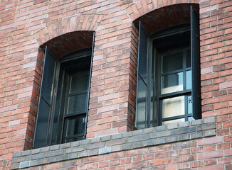 Fototapeta na wymiar old brick wall with windows