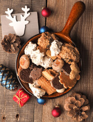 Christmas cookies in a bowl on a wooden table