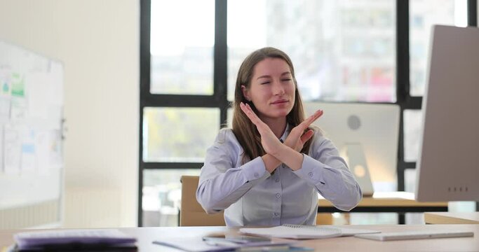 Woman showing crossed arms and no symbol