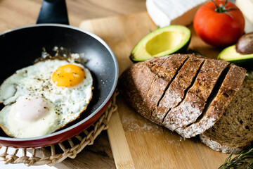 Traditional breakfast of scrambled eggs and toast. Cooking concept